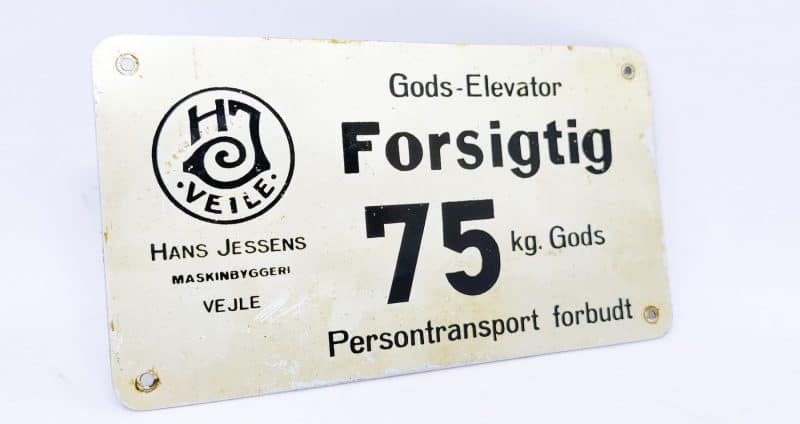 Hans Jessens Forsigtig 75 kg Gods - blikskilt fra elevator