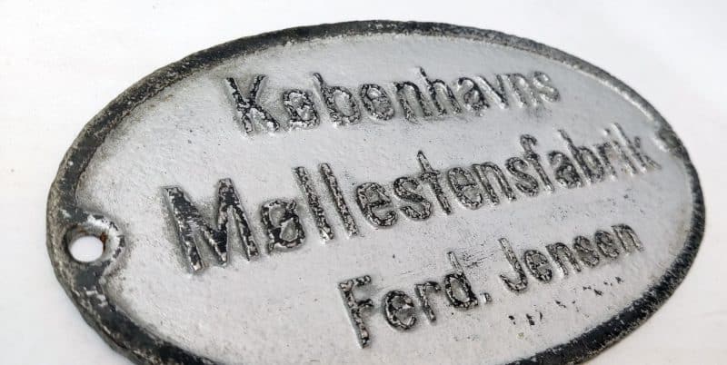 Københavns Møllestensfabrik Ferd. Jensen - Skilt i støbejern