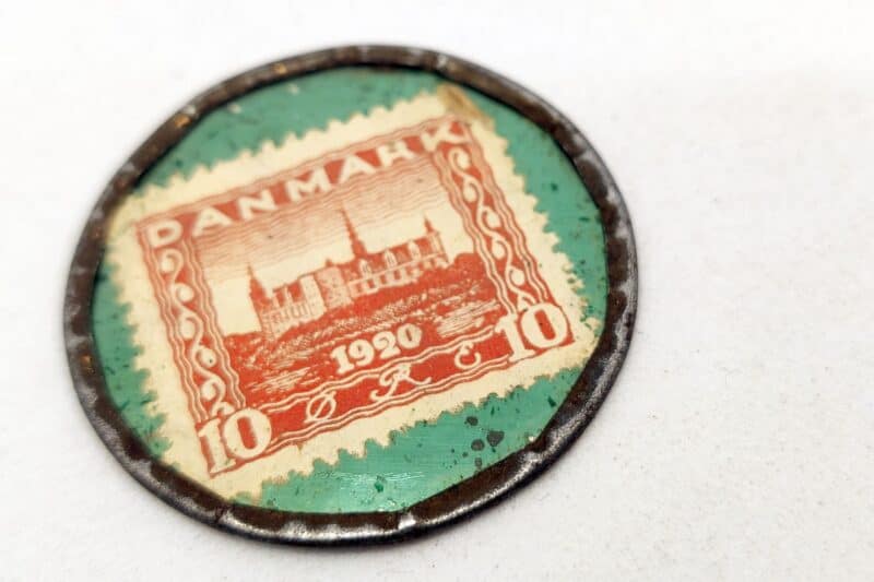Postskillemønt. Cremo Tobak - brænder ikke paa tungen. 1920 (1920-1922). 10 øres frimærke