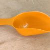 Måleske. Melske i orange plast