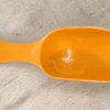Måleske. Melske i orange plast
